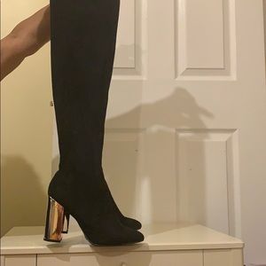 Knee high boots with gold heel